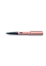 Experience the elegance of the Lx Fountain Pen in rosegold, a sophisticated blend of style and function. Crafted with anodised aluminium and adorned with gold-plated details, this glossy black nib offers a superior writing experience. Ergonomically designed with a transparent grip and equipped with LAMY T 10 blue ink cartridge, it's more than a pen - it's a statement of refinement.